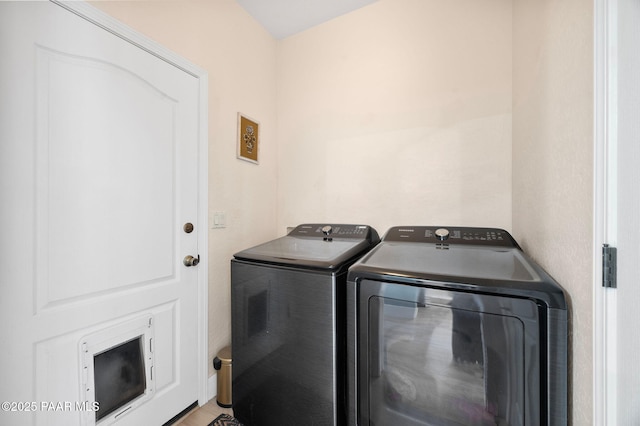 laundry room featuring washing machine and dryer