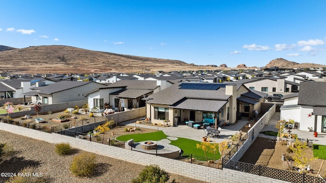 birds eye view of property featuring a mountain view