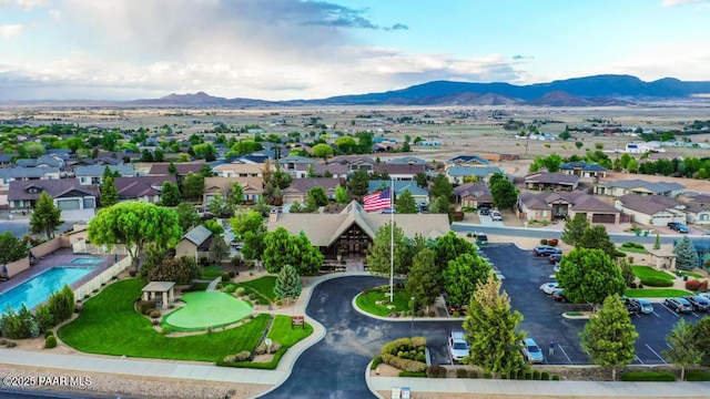 7785 E Bramble Berry Ln, Prescott Valley, AZ 86315 - aerial perspective of suburban area featuring mountains and a pool area