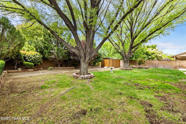 7785 E Bramble Berry Ln, Prescott Valley, AZ 86315 - view of yard featuring a storage unit and an outbuilding