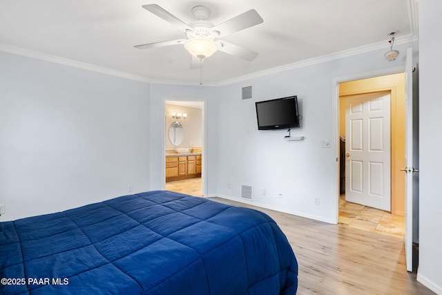 bedroom featuring crown molding, baseboards, light wood finished floors, a ceiling fan, and ensuite bathroom