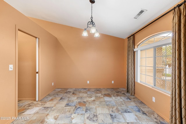 7785 E Bramble Berry Ln, Prescott Valley, AZ 86315 - spare room with light stone finish flooring, baseboards, and a chandelier