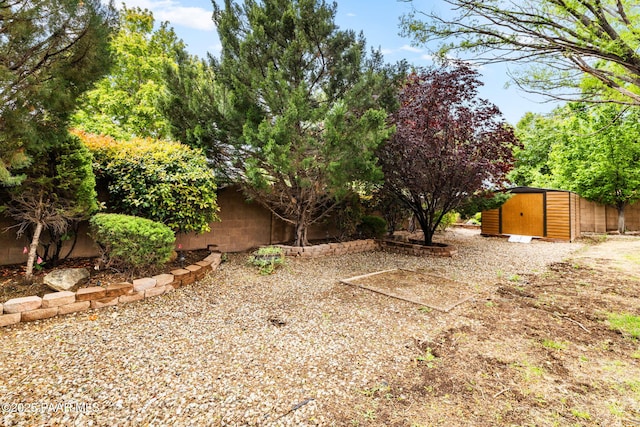 7785 E Bramble Berry Ln, Prescott Valley, AZ 86315 - view of yard featuring a shed, an outbuilding, and fence