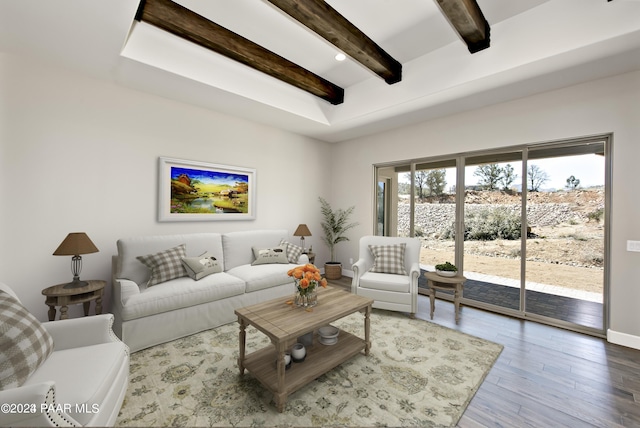 living room with beamed ceiling, wood finished floors, and baseboards