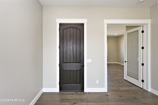 entrance foyer with baseboards, wood finished floors, and recessed lighting