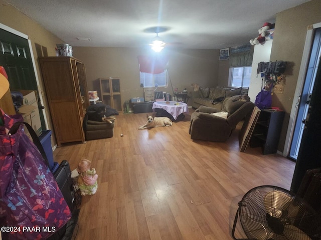 interior space with ceiling fan and light hardwood / wood-style flooring