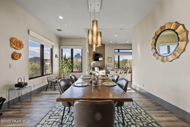 dining area with dark hardwood / wood-style floors