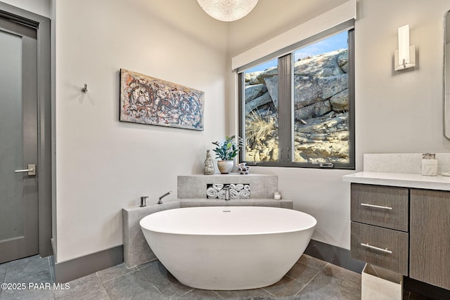 bathroom featuring a bathing tub and vanity