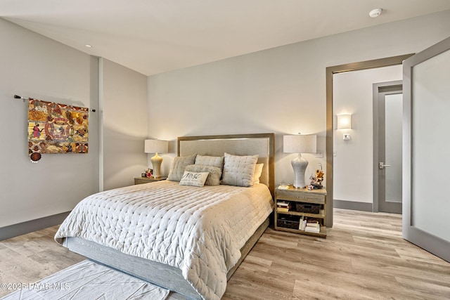 bedroom with light hardwood / wood-style flooring