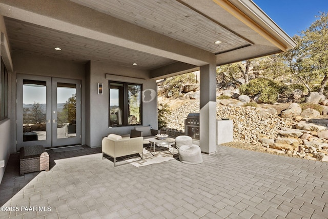 view of patio featuring outdoor lounge area and french doors