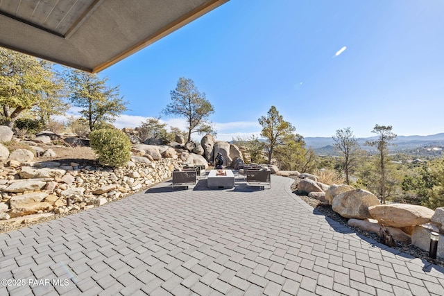 view of patio / terrace featuring outdoor lounge area and a mountain view