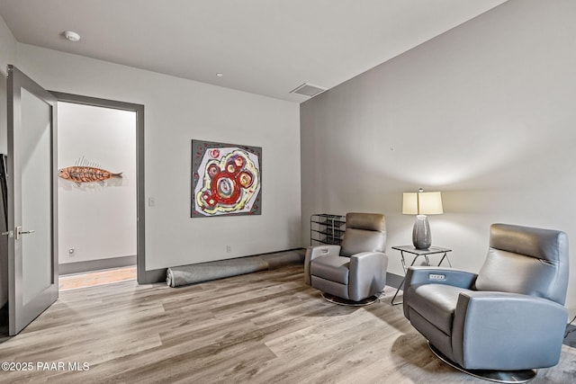 living area with light hardwood / wood-style floors