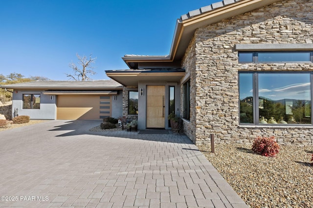 entrance to property featuring a garage