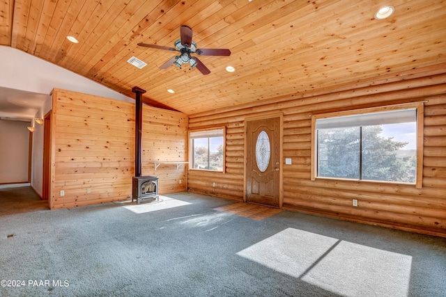 2570 S Colina Ln, Dewey-Humboldt, AZ 86329 - unfurnished living room with wooden ceiling, a wood stove, recessed lighting, vaulted ceiling, and log walls