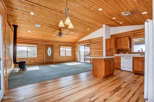 2570 S Colina Ln, Dewey-Humboldt, AZ 86329 - kitchen featuring white appliances, a wood stove, open floor plan, log walls, and wood ceiling
