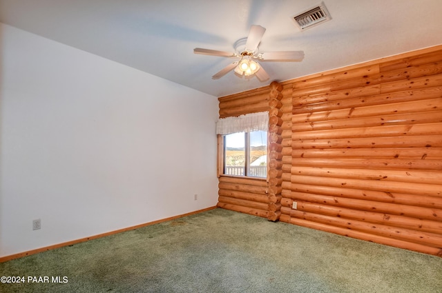 2570 S Colina Ln, Dewey-Humboldt, AZ 86329 - carpeted spare room with rustic walls and ceiling fan