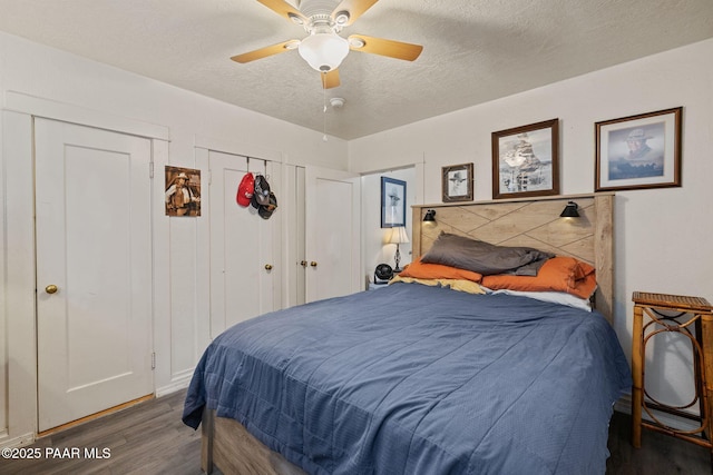 bedroom with a ceiling fan, wood finished floors, and a textured ceiling