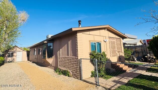 327 N Arizona Ave, Prescott, AZ 86301 - view of side of home featuring fence and an outbuilding