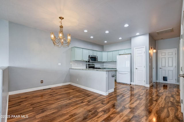 1017 N Fairway Dr, Dewey-Humboldt, AZ 86327 - kitchen featuring freestanding refrigerator, stainless steel microwave, a peninsula, recessed lighting, and baseboards