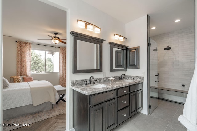 10550 E Cumberland Ct, Dewey-Humboldt, AZ 86327 - full bath with ceiling fan, a tile shower, a sink, and ensuite bathroom