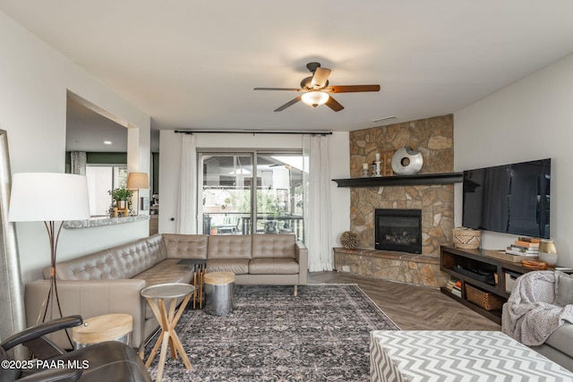 10550 E Cumberland Ct, Dewey-Humboldt, AZ 86327 - living room with a stone fireplace and a ceiling fan