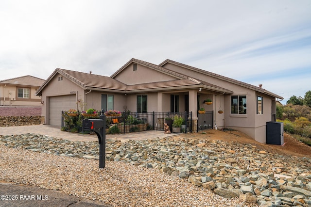 10550 E Cumberland Ct, Dewey-Humboldt, AZ 86327 - ranch-style home with driveway, fence, cooling unit, an attached garage, and stucco siding