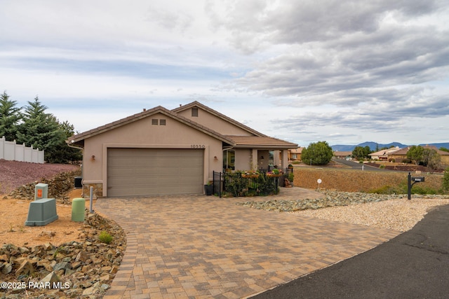 10550 E Cumberland Ct, Dewey-Humboldt, AZ 86327 - single story home with a garage, stucco siding, driveway, and fence