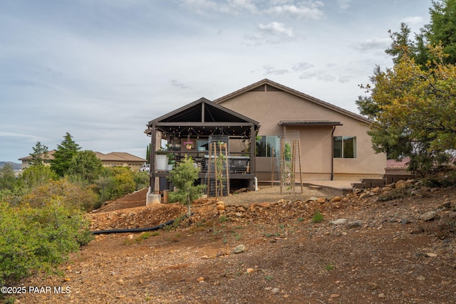 10550 E Cumberland Ct, Dewey-Humboldt, AZ 86327 - back of house featuring a gazebo and stucco siding
