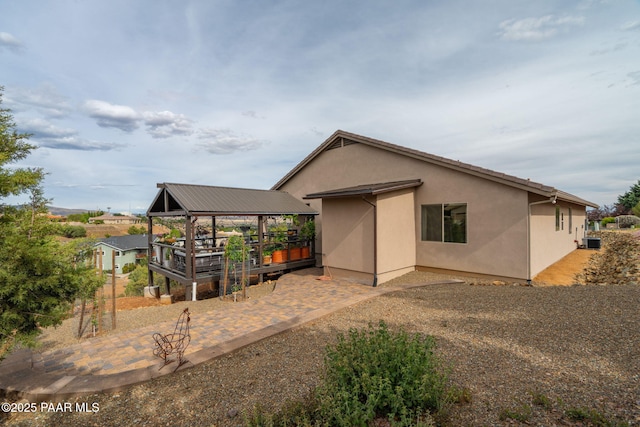 10550 E Cumberland Ct, Dewey-Humboldt, AZ 86327 - rear view of house featuring central AC unit and stucco siding