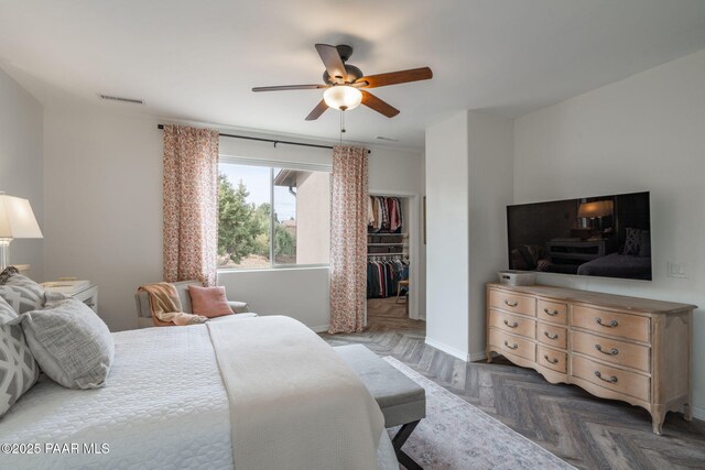 10550 E Cumberland Ct, Dewey-Humboldt, AZ 86327 - bedroom with ceiling fan, baseboards, a spacious closet, visible vents, and a closet