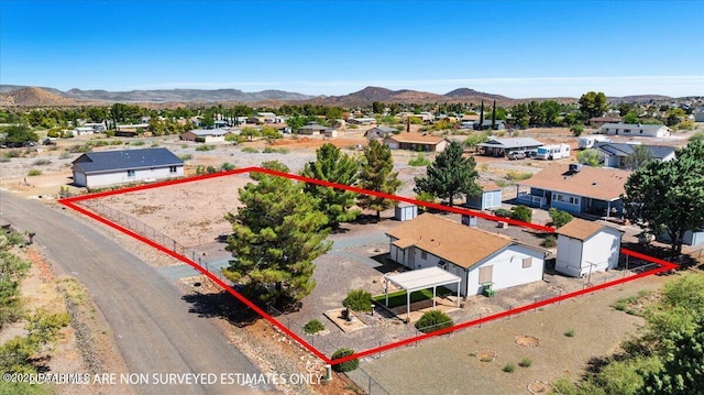 20249 E Prickly Pear Dr, Mayer, AZ 86333 - aerial perspective of suburban area with property parcel outlined and a mountain backdrop