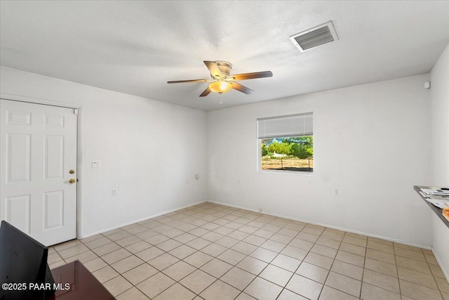 20249 E Prickly Pear Dr, Mayer, AZ 86333 - spare room with ceiling fan, light tile patterned floors, and a textured ceiling