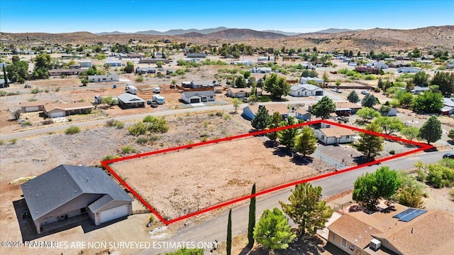 20249 E Prickly Pear Dr, Mayer, AZ 86333 - aerial view of residential area with a mountainous background and property boundaries highlighted