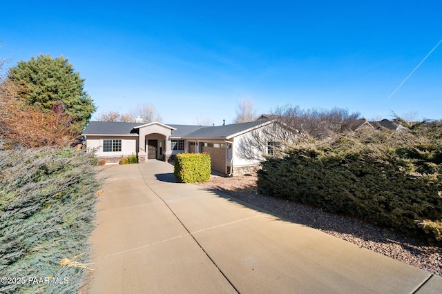 ranch-style house featuring a garage