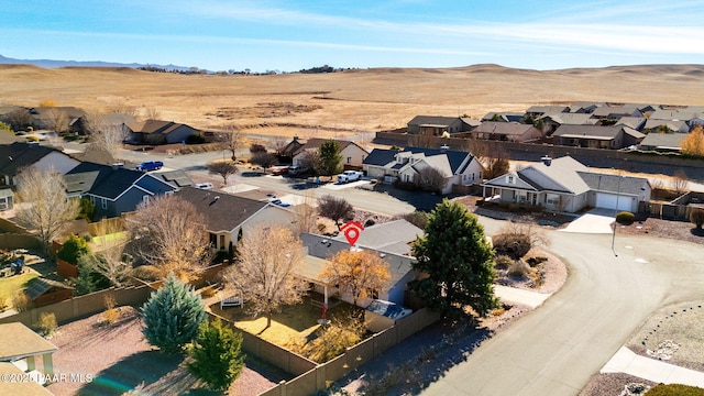 birds eye view of property with a mountain view