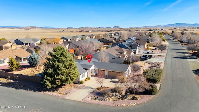 birds eye view of property featuring a mountain view