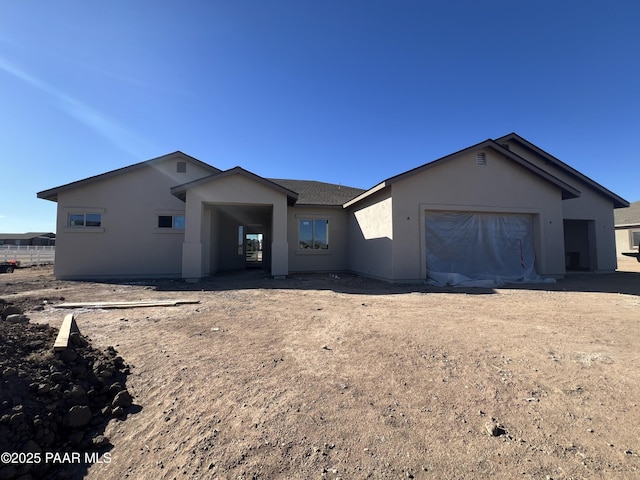 single story home featuring a garage