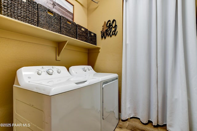 6166 E Walden Way, Prescott Valley, AZ 86314 - washroom with washer and clothes dryer and light wood finished floors