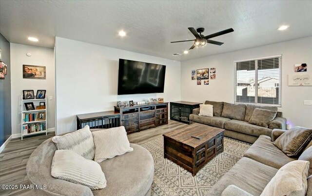 1680 Bainbridge Ln, Chino Valley, AZ 86323 - living room with wood finished floors, a ceiling fan, and recessed lighting