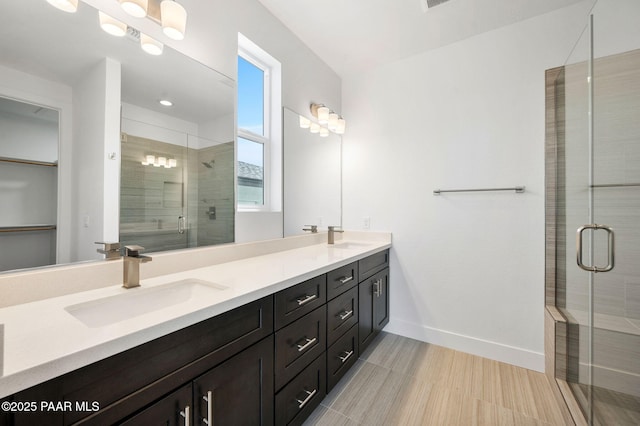 7492 E Louie Ln, Prescott Valley, AZ 86315 - full bathroom with a shower stall, double vanity, a sink, and baseboards