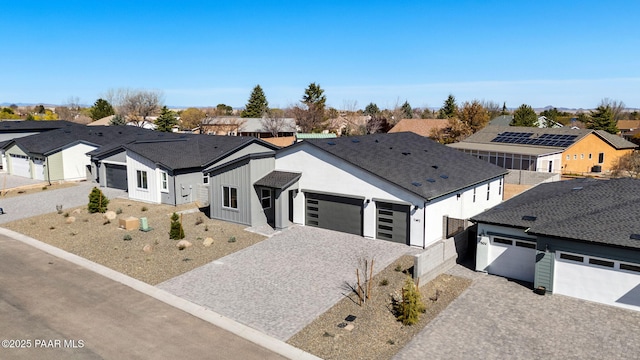 7492 E Louie Ln, Prescott Valley, AZ 86315 - modern farmhouse style home featuring a residential view, driveway, an attached garage, fence, and a shingled roof