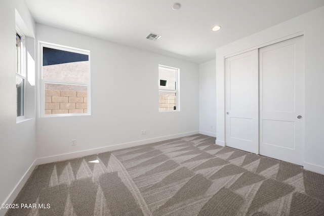 7492 E Louie Ln, Prescott Valley, AZ 86315 - unfurnished bedroom featuring a closet, baseboards, recessed lighting, visible vents, and carpet