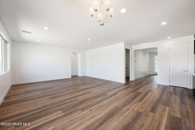 7492 E Louie Ln, Prescott Valley, AZ 86315 - empty room with recessed lighting, visible vents, an inviting chandelier, and wood finished floors