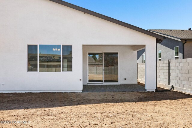 7492 E Louie Ln, Prescott Valley, AZ 86315 - rear view of property with fence, a patio, and stucco siding