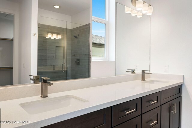 7492 E Louie Ln, Prescott Valley, AZ 86315 - bathroom featuring recessed lighting, double vanity, a sink, and a stall shower