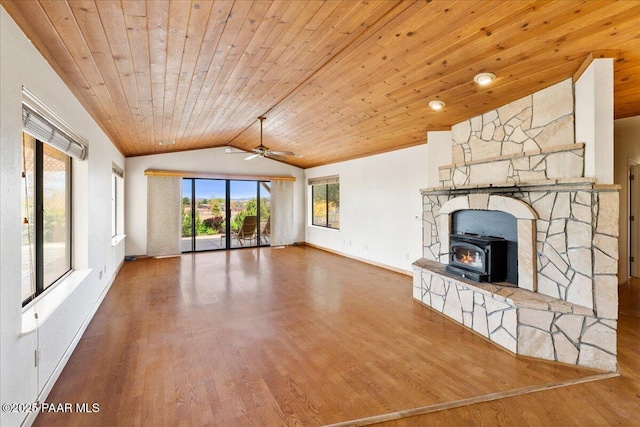 1640 W Grasshopper Ln, Chino Valley, AZ 86323 - unfurnished living room with lofted ceiling, wooden ceiling, wood finished floors, a ceiling fan, and a wood stove