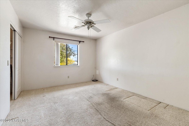 1640 W Grasshopper Ln, Chino Valley, AZ 86323 - unfurnished bedroom with carpet flooring, a ceiling fan, and a closet