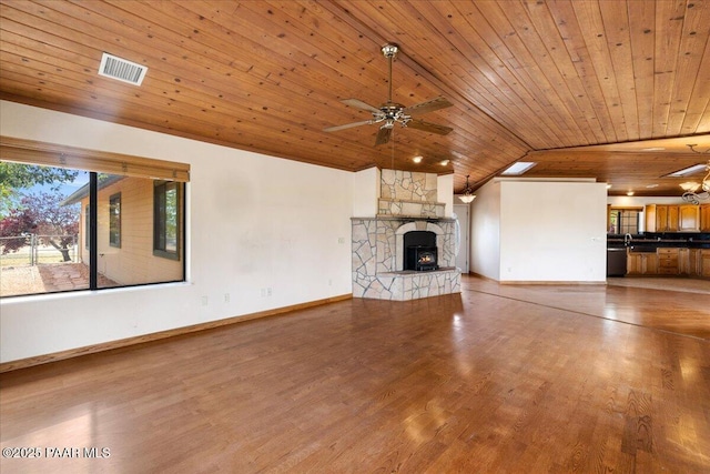 1640 W Grasshopper Ln, Chino Valley, AZ 86323 - unfurnished living room featuring lofted ceiling, wooden ceiling, ceiling fan, a fireplace, and wood finished floors