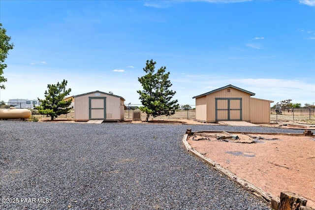 1640 W Grasshopper Ln, Chino Valley, AZ 86323 - view of yard featuring a storage shed, an outbuilding, and fence