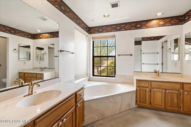 1640 W Grasshopper Ln, Chino Valley, AZ 86323 - full bath with toilet, a garden tub, and two vanities